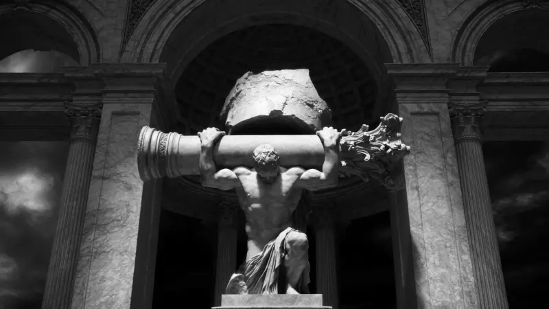 Marble titan kneeling beneath a broken Corinthian column inside a coffered arch